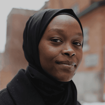 woman in black hijab and black coat