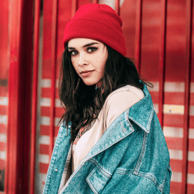 selective focus photography of woman wearing red knit cap