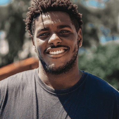 selective focus of man smiling during daytime